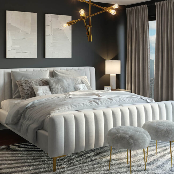 Elegant bedroom with tufted bed and gold accents.