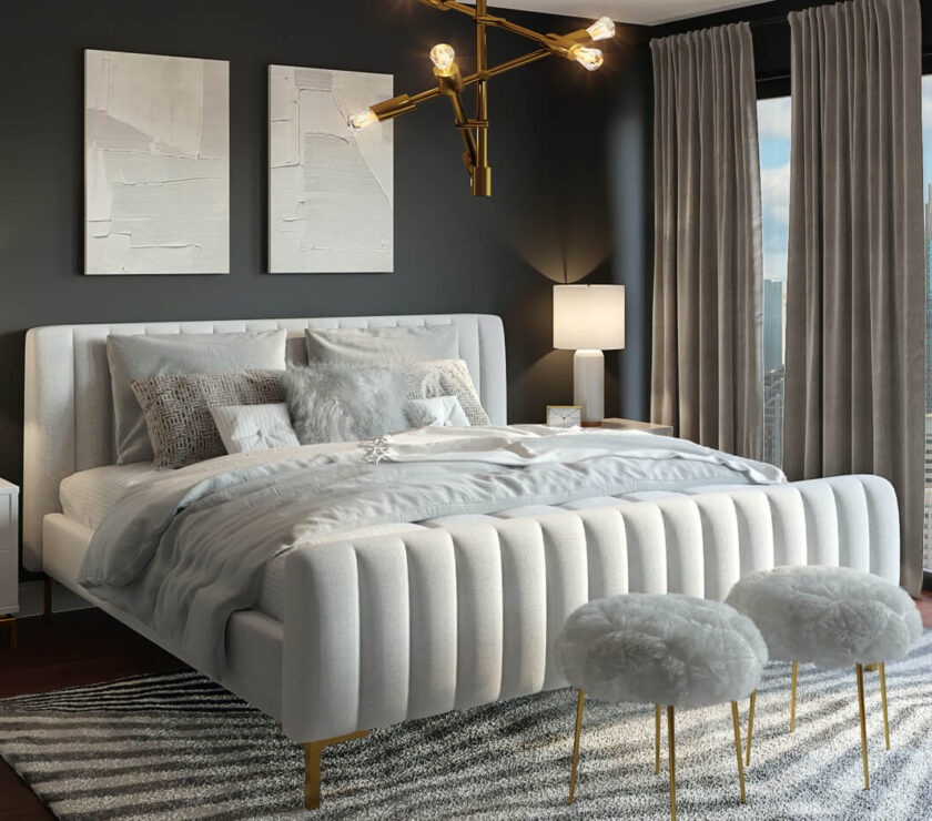Elegant bedroom with tufted bed and gold accents.