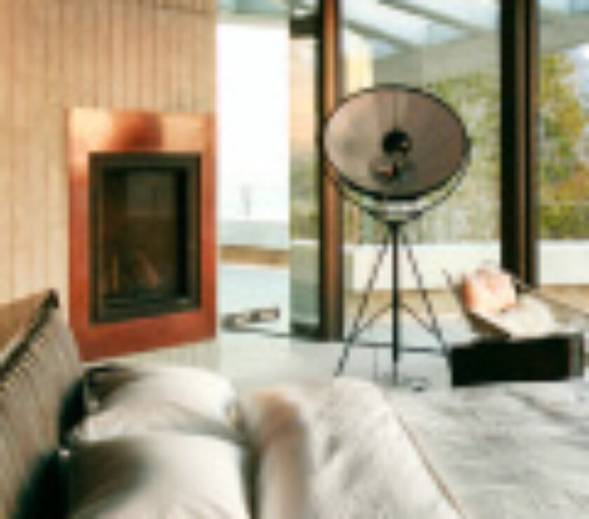 Cozy living room with a fireplace and modern decor.